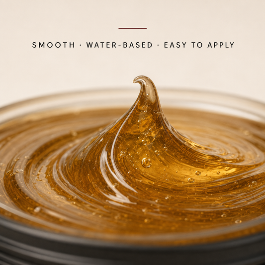 Close-up of translucent amber Gracia Grooming high shine pomade texture